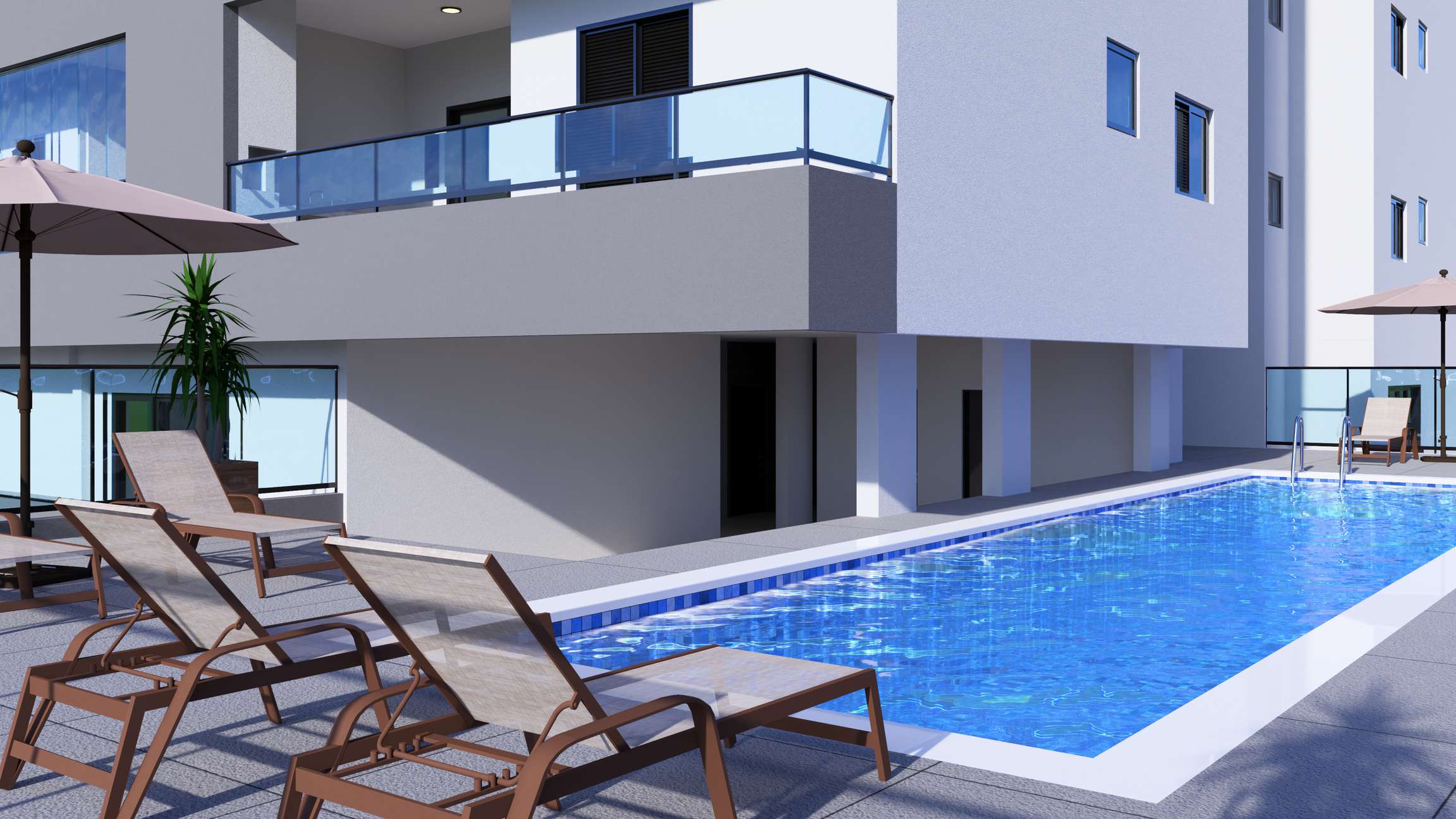 Piscina do Residencial Trieste com espreguiçadeiras e vista para o estacionamento coberto